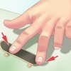 Gör en kickflip på en greppbräda