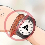 Ha på sig ett armbandsur