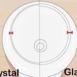 Skiljer kristall från glas