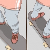 Stående på en skateboard