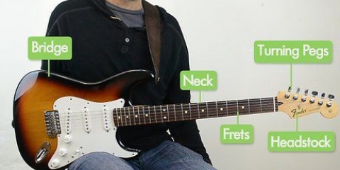 Spelar gitarr