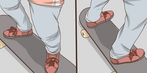 Stående på en skateboard