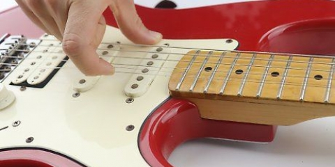 Byta strängar på en elgitarr