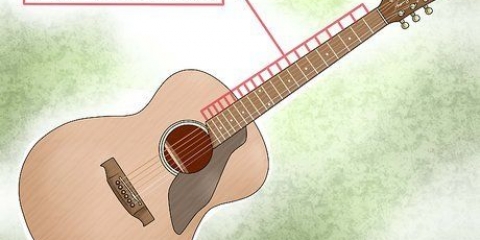 Spelar skalor på en gitarr